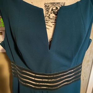 Slightly worn A Line dress with V neck. Knee length